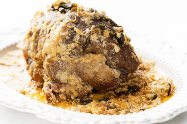 A pork loin covered in curdled milk sauce